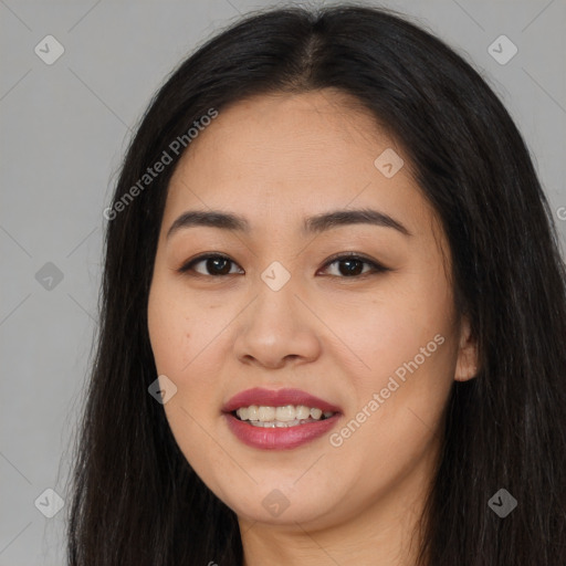 Joyful asian young-adult female with long  brown hair and brown eyes