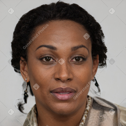 Joyful black adult female with short  brown hair and brown eyes