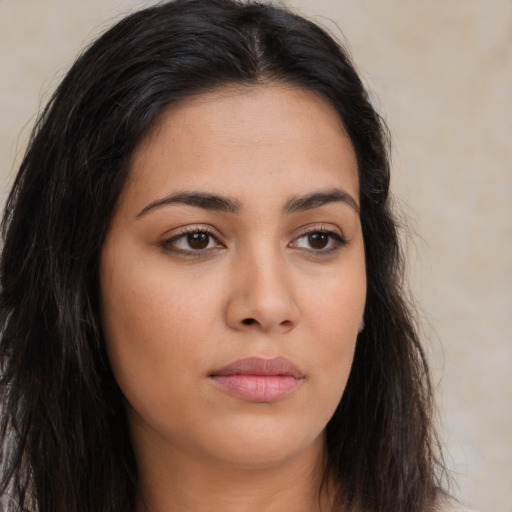 Neutral latino young-adult female with long  brown hair and brown eyes