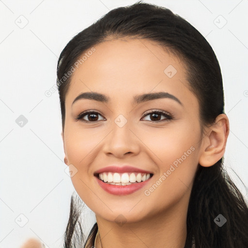 Joyful white young-adult female with long  black hair and brown eyes