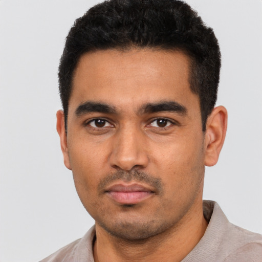 Neutral latino young-adult male with short  black hair and brown eyes