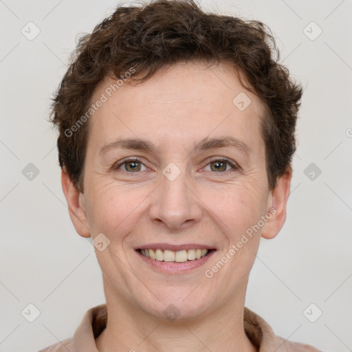 Joyful white adult female with short  brown hair and brown eyes