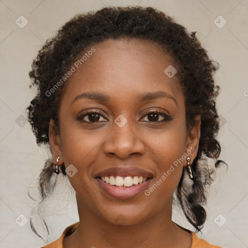 Joyful black young-adult female with medium  brown hair and brown eyes