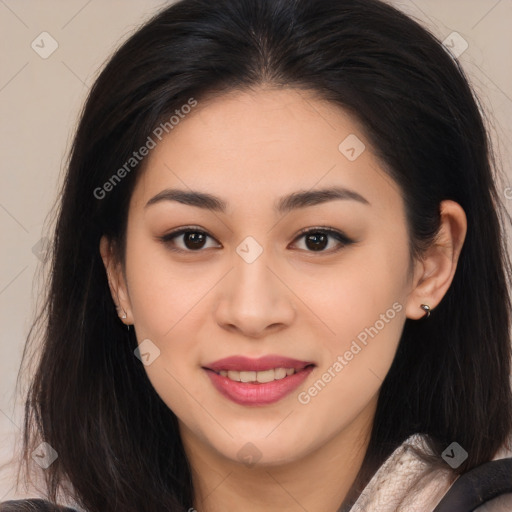 Joyful asian young-adult female with long  brown hair and brown eyes