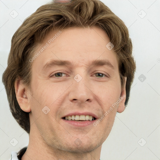 Joyful white adult male with short  brown hair and grey eyes