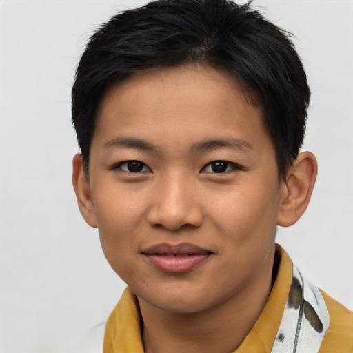 Joyful asian young-adult male with short  brown hair and brown eyes