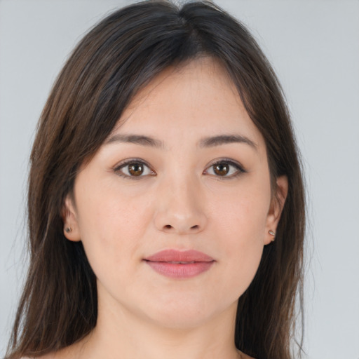 Joyful asian young-adult female with long  brown hair and brown eyes