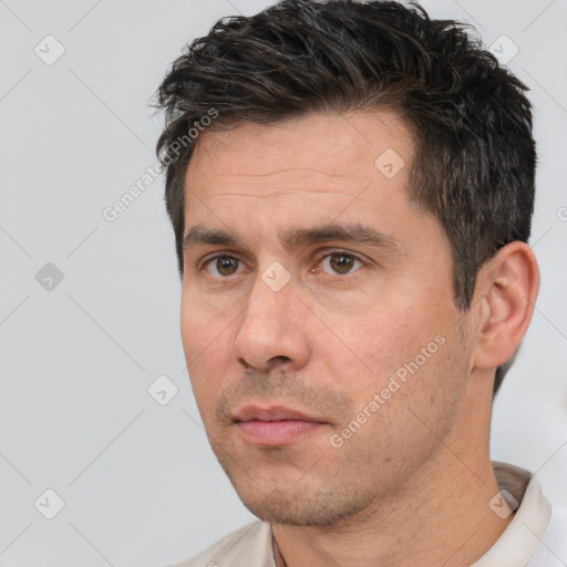 Neutral white adult male with short  black hair and brown eyes