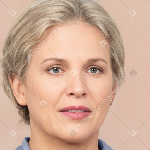 Joyful white adult female with medium  brown hair and grey eyes