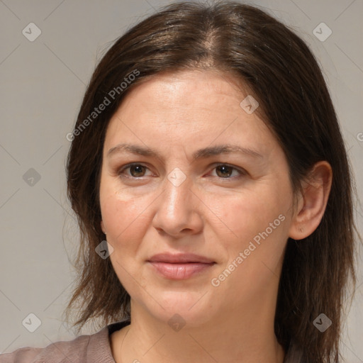 Joyful white adult female with medium  brown hair and brown eyes