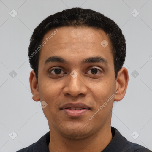 Joyful black young-adult male with short  black hair and brown eyes