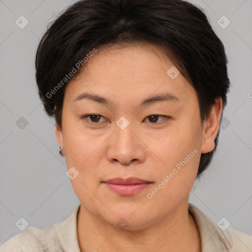 Joyful asian young-adult female with short  brown hair and brown eyes