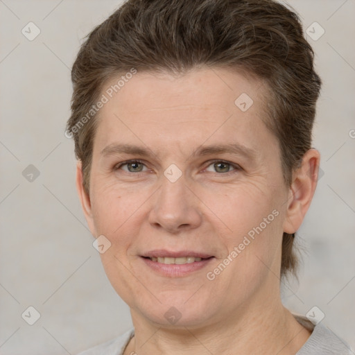 Joyful white adult female with short  brown hair and grey eyes