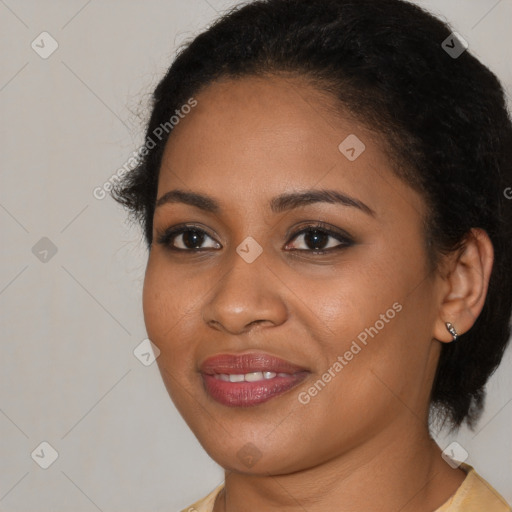 Joyful black young-adult female with medium  brown hair and brown eyes