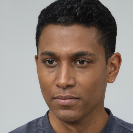 Neutral black young-adult male with short  black hair and brown eyes