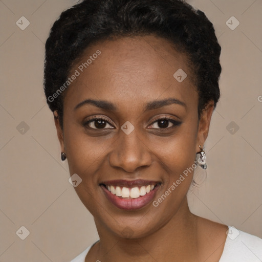 Joyful black young-adult female with short  black hair and brown eyes