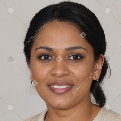 Joyful black young-adult female with medium  black hair and brown eyes