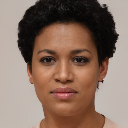 Joyful black young-adult female with short  brown hair and brown eyes