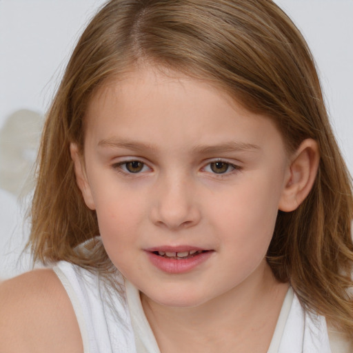 Joyful white child female with medium  brown hair and brown eyes