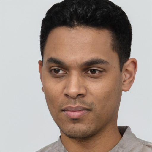 Neutral latino young-adult male with short  black hair and brown eyes