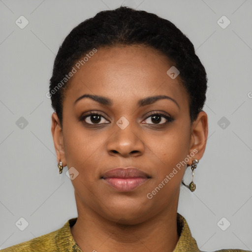 Joyful black young-adult female with short  black hair and brown eyes