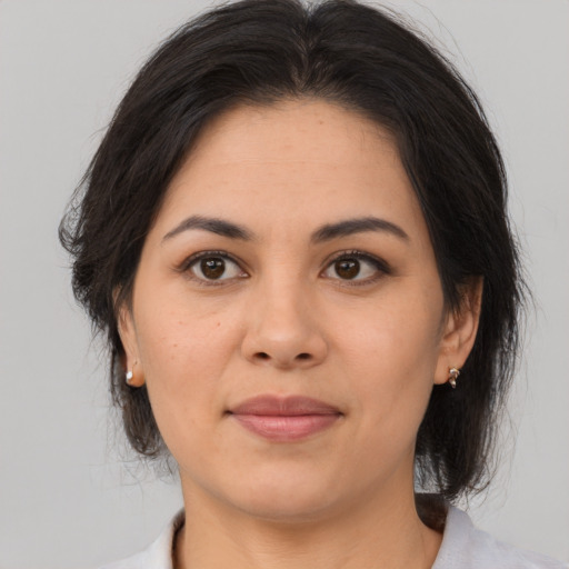 Joyful white young-adult female with medium  brown hair and brown eyes