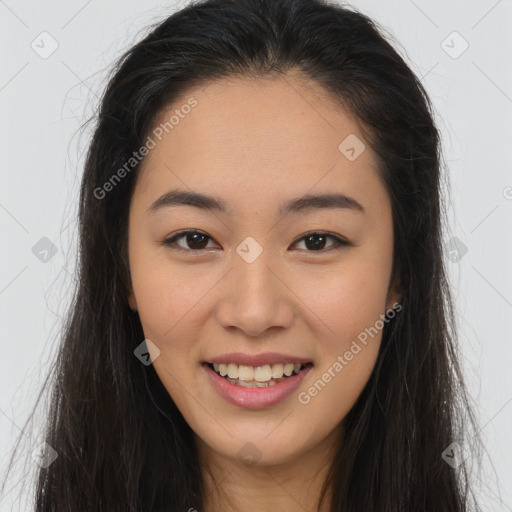 Joyful asian young-adult female with long  brown hair and brown eyes