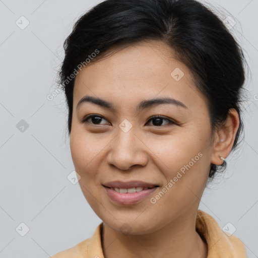 Joyful asian young-adult female with medium  brown hair and brown eyes