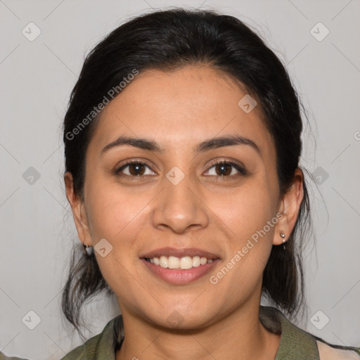 Joyful latino young-adult female with medium  brown hair and brown eyes