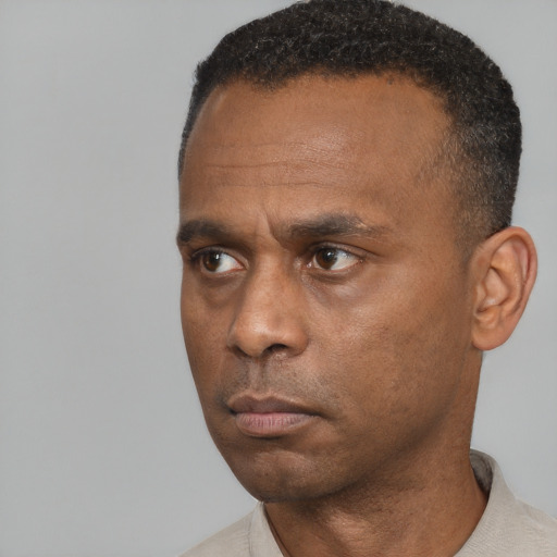 Neutral black adult male with short  black hair and brown eyes