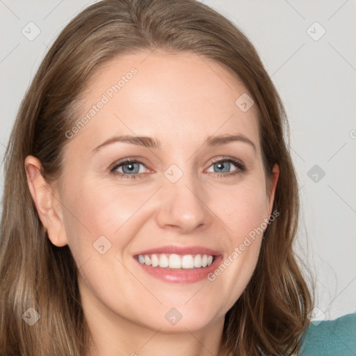 Joyful white young-adult female with long  brown hair and grey eyes