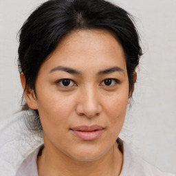 Joyful asian young-adult female with medium  brown hair and brown eyes