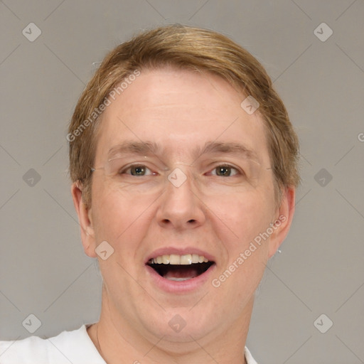 Joyful white adult male with short  brown hair and brown eyes