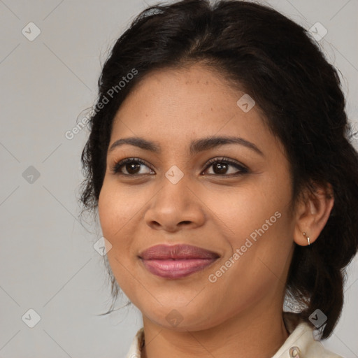 Joyful latino young-adult female with medium  brown hair and brown eyes