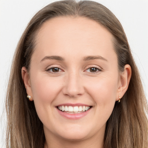 Joyful white young-adult female with long  brown hair and grey eyes