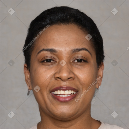 Joyful latino adult female with short  brown hair and brown eyes