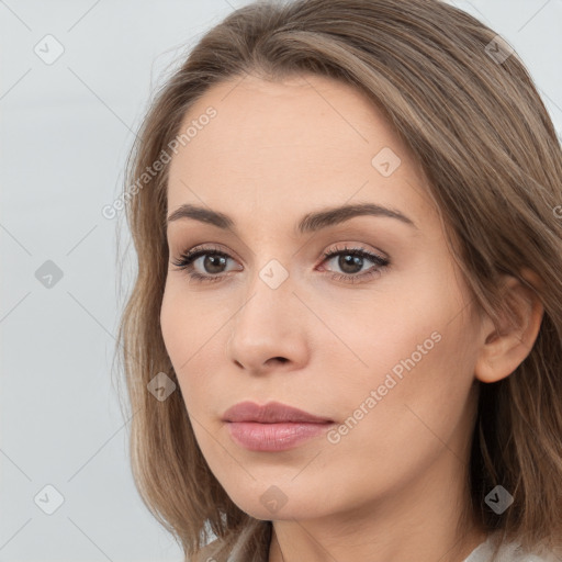 Neutral white young-adult female with long  brown hair and brown eyes