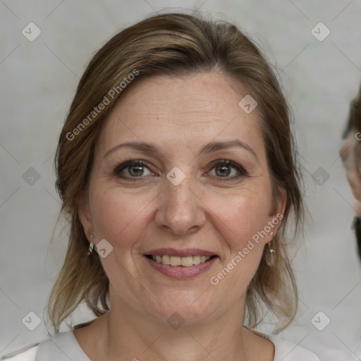 Joyful white adult female with medium  brown hair and grey eyes