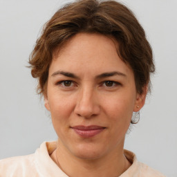 Joyful white adult female with short  brown hair and brown eyes