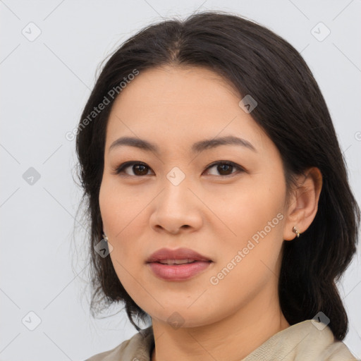 Joyful asian young-adult female with medium  black hair and brown eyes