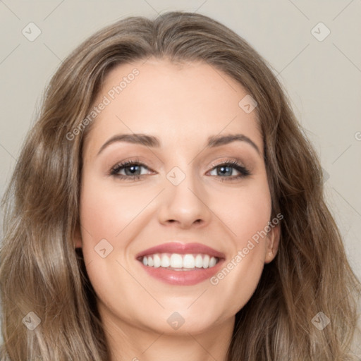 Joyful white young-adult female with long  brown hair and green eyes