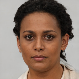 Neutral black adult female with short  brown hair and brown eyes