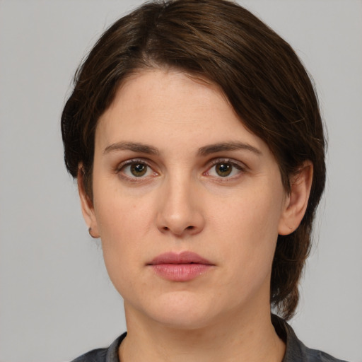 Neutral white young-adult female with medium  brown hair and brown eyes