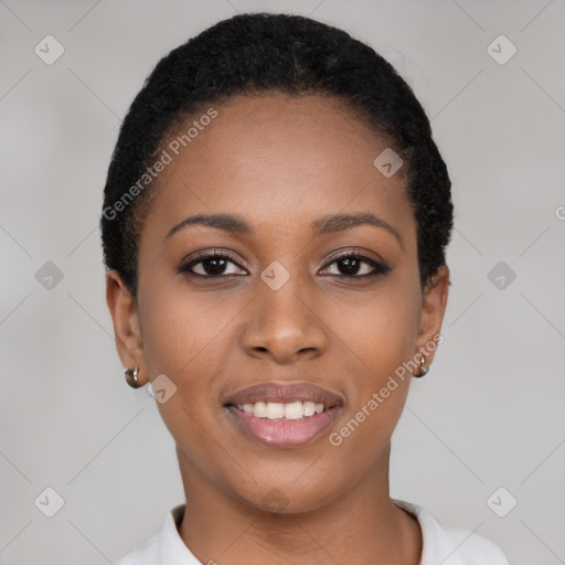 Joyful black young-adult female with short  black hair and brown eyes