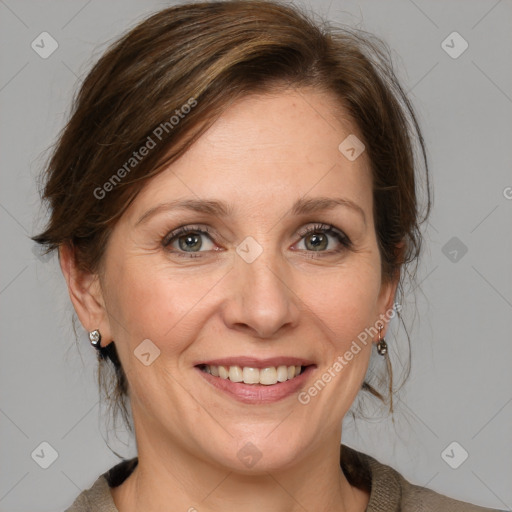 Joyful white adult female with medium  brown hair and grey eyes