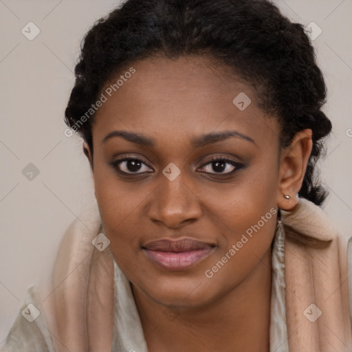 Joyful black young-adult female with long  brown hair and brown eyes