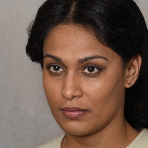 Neutral black young-adult female with long  brown hair and brown eyes