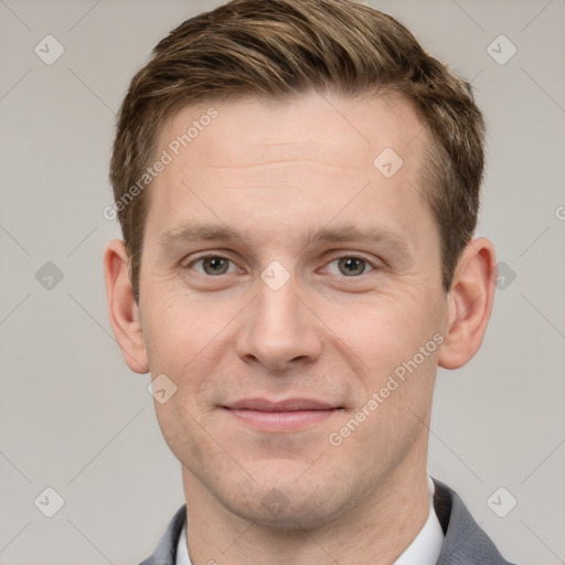 Joyful white adult male with short  brown hair and grey eyes