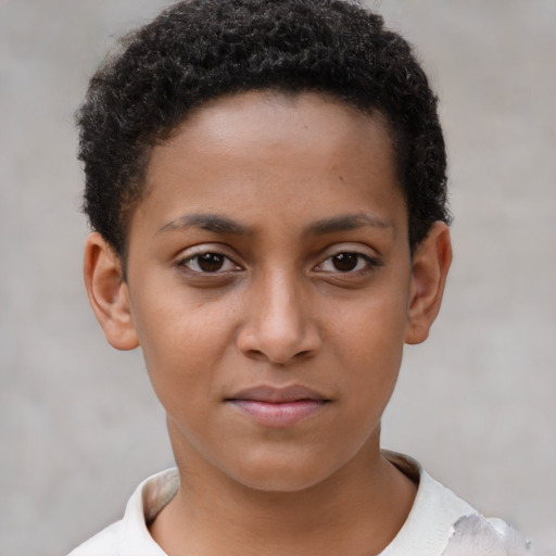 Joyful black child female with short  brown hair and brown eyes