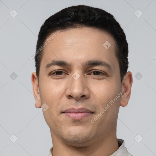 Joyful white young-adult male with short  black hair and brown eyes